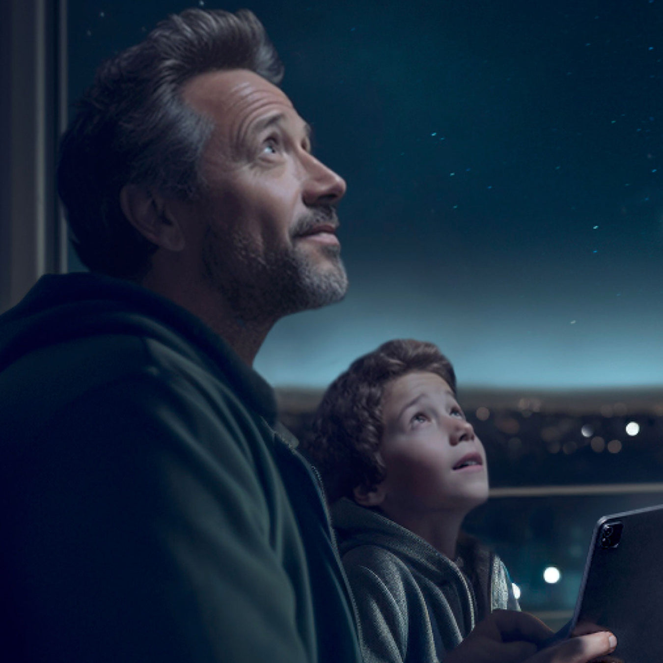 Father and son looking at the stars
